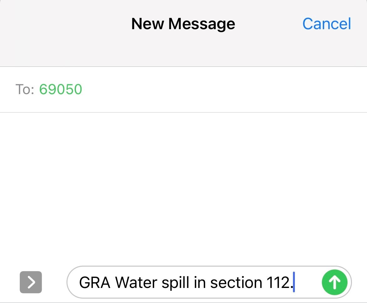 Image of text message sent to 69050 with text "GRA Water spill in section 112"