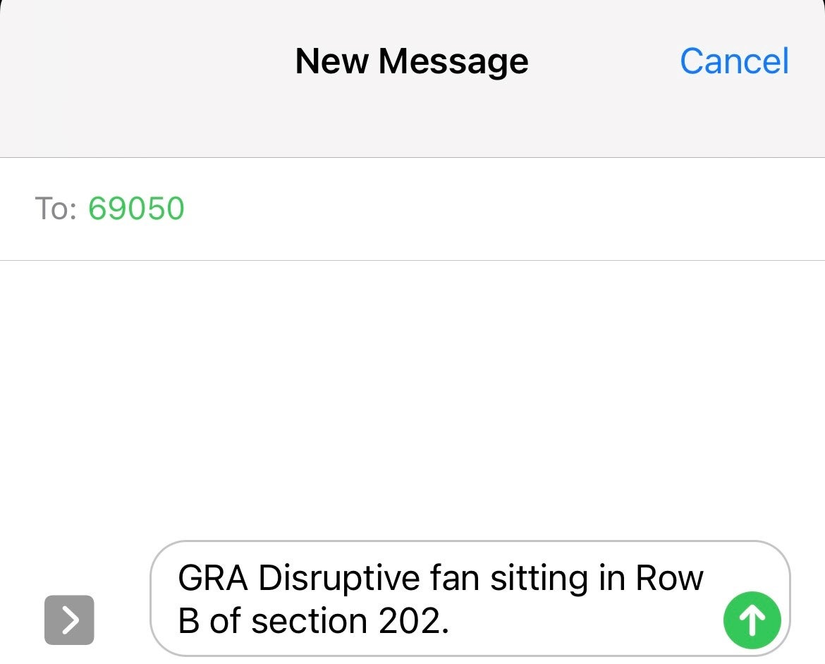 Image of text message sent to 69050 with text "GRA Disruptive fan sitting in Row B of section 202"